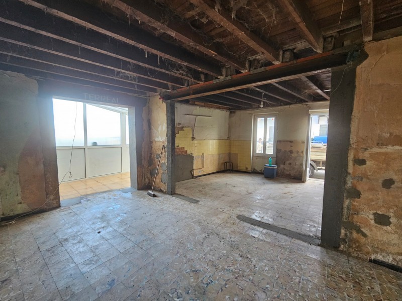 Création d'une ouverture dans des murs anciens en briquette et en pierres à Gujan Mestras