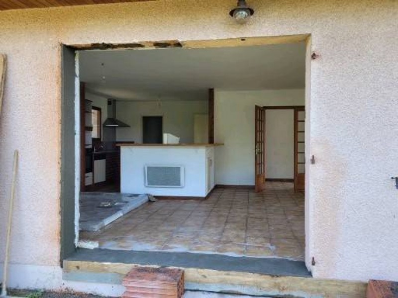 Réalisation d'une ouverture pour une baie vitrée dans un salon à Arcachon